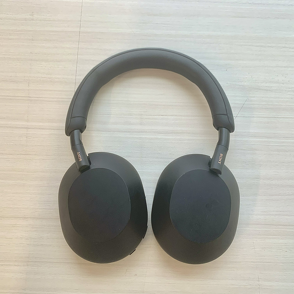 <b>Top View of My Headphones</b><br>This is a top view of my Sony headphones. The headphones are laid flat on a surface, showing the sleek black design and soft ear cushions.