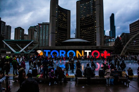<b>Toronto Downtown Neon Landmark</b><br>This second photo, which I downloaded from Pexels, captures the iconic neon 'TORONTO' sign in downtown Toronto. Initially installed for the Pan Am Games, the sign has since become a permanent attraction and a symbol of the city. It’s now a popular gathering place for both locals and tourists, serving as a backdrop for photos and events, particularly in the bustling Nathan Phillips Square.