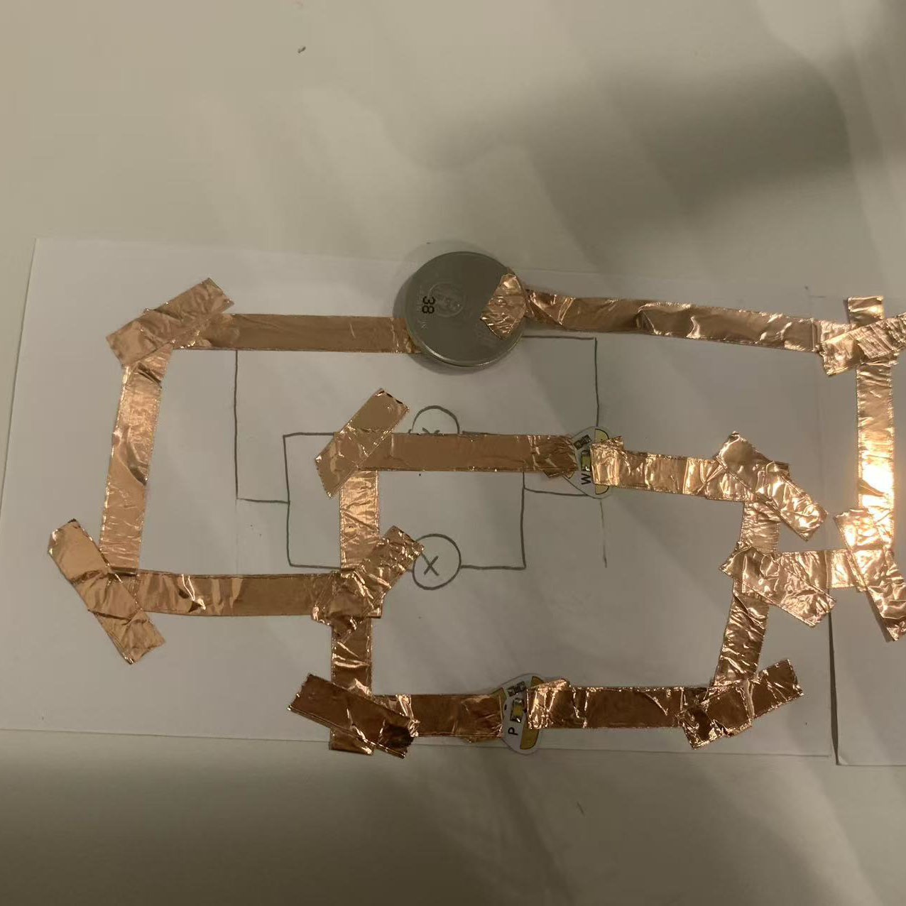 I assembled the circuit using copper tape, a battery, and LEDs. The structure follows my diagram closely.