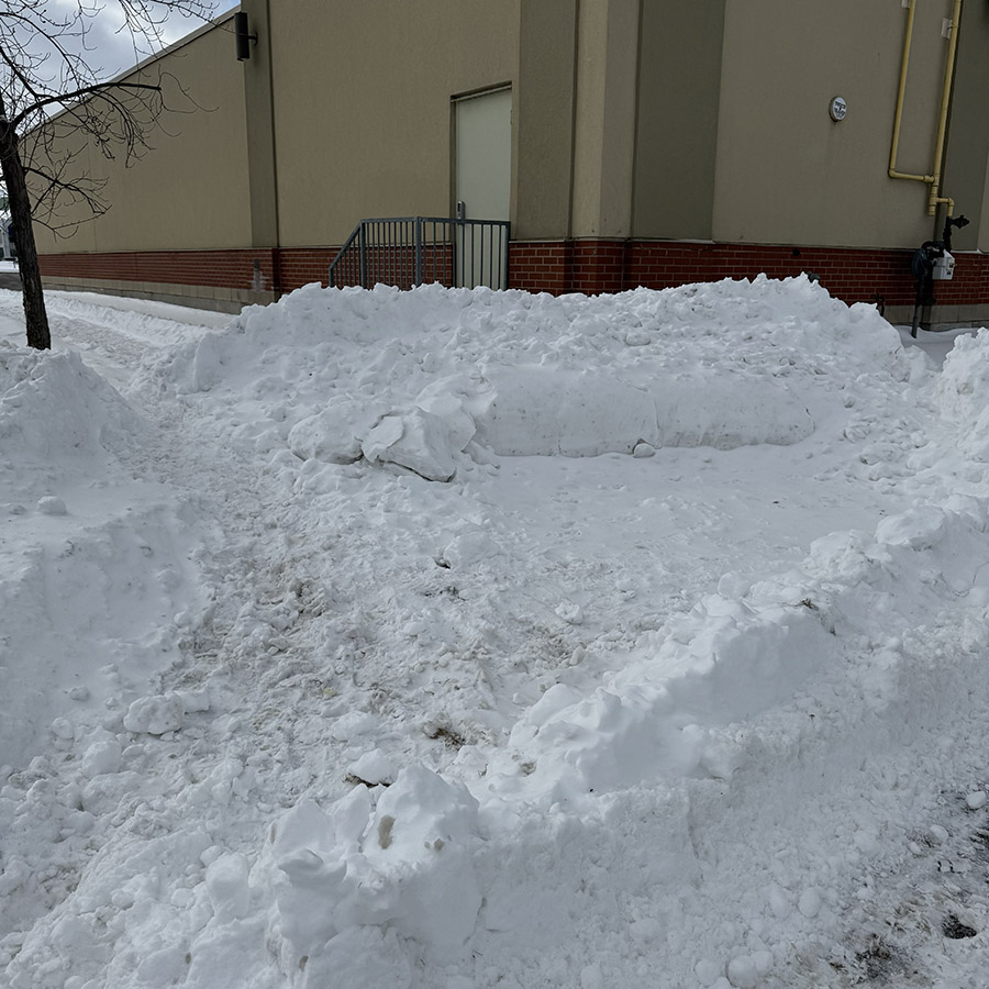 A large mound of snow with footprints, capturing the crunching sound of footsteps through fresh snow.