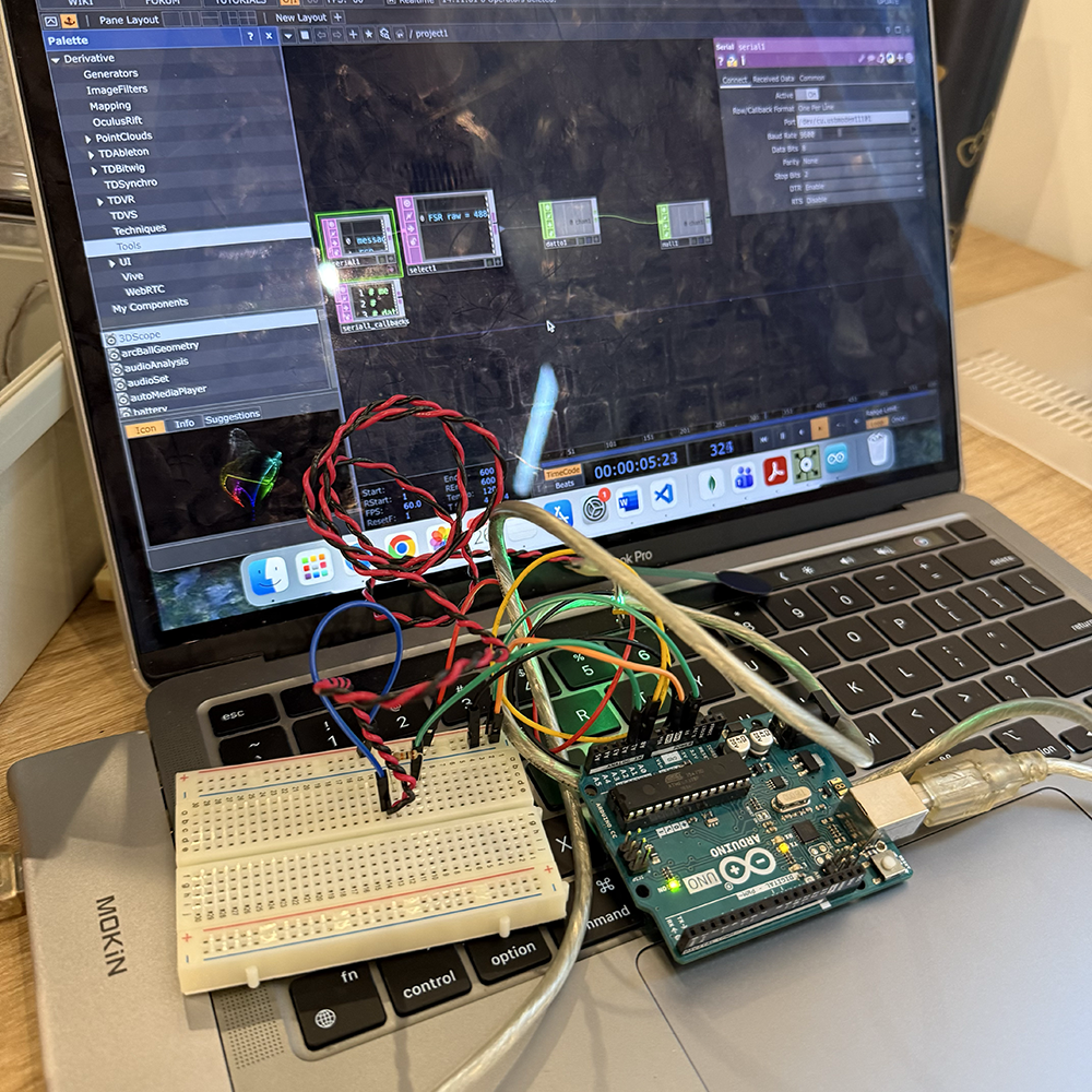 <b>Full setup with Arduino and TouchDesigner</b><br>We tested the full setup by connecting Arduino and the breadboard to the laptop while running TouchDesigner. We checked the real-time data flow and made sure both the force sensor and pulse sensor could send values to TouchDesigner at the same time.